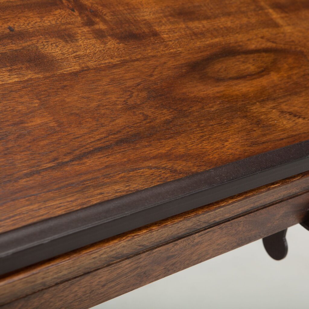 Close up of the writing surface of a high-quality wood drafting table