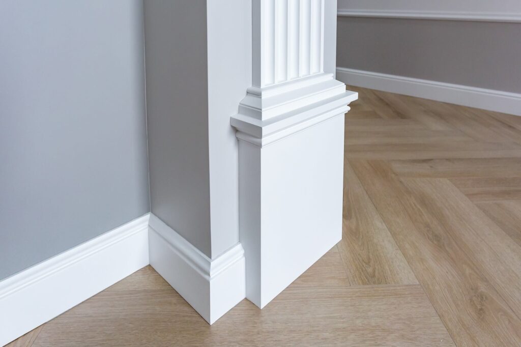 Detail of corner flooring with intricate wood for molding.