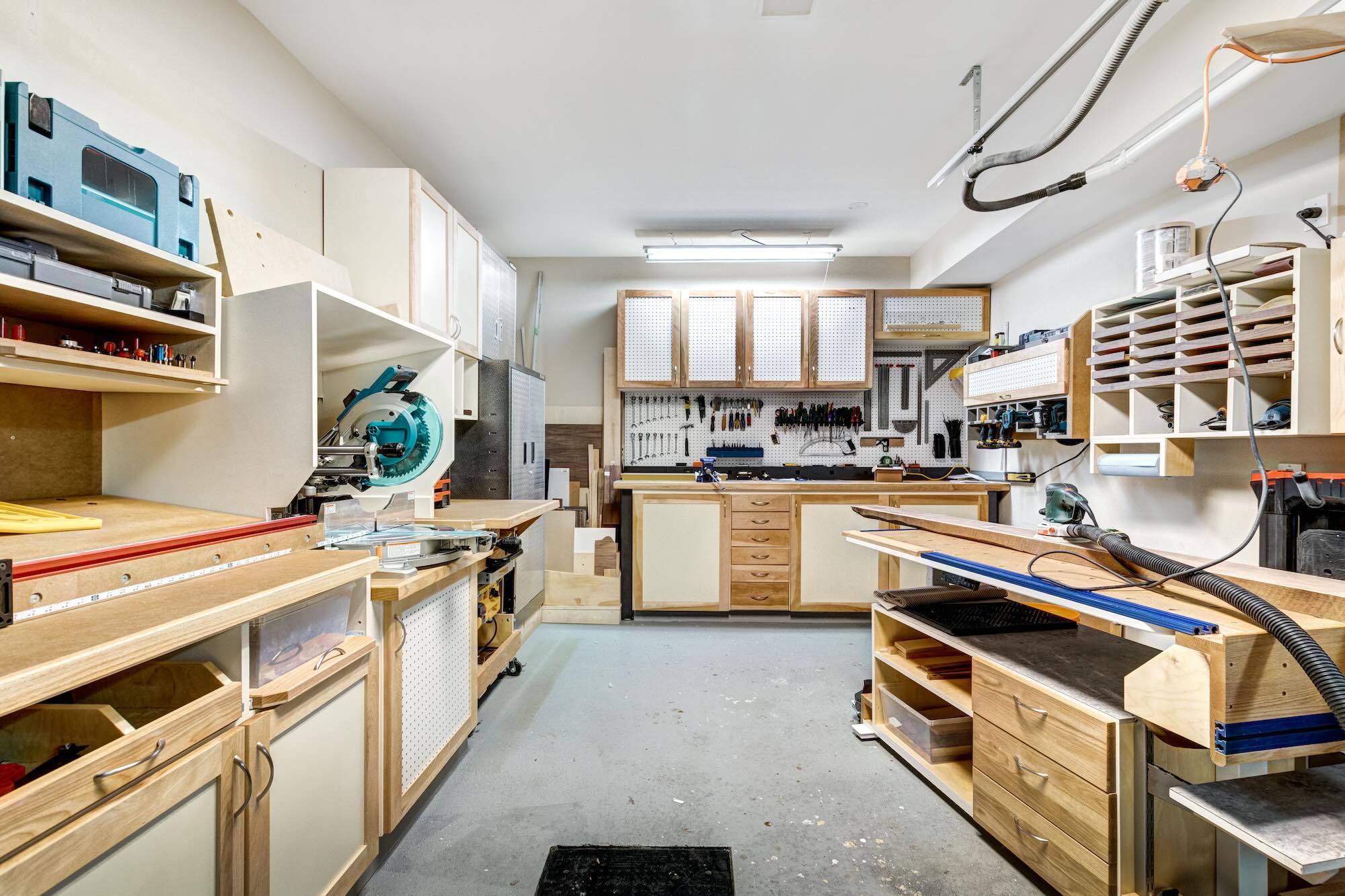 Wood garage cabinets in a workshop area