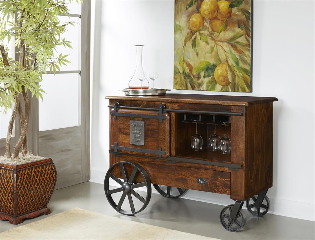 This vintage inspired bar cart is finished in a Warm Brown Mango to bring out the natural beauty of the wood.