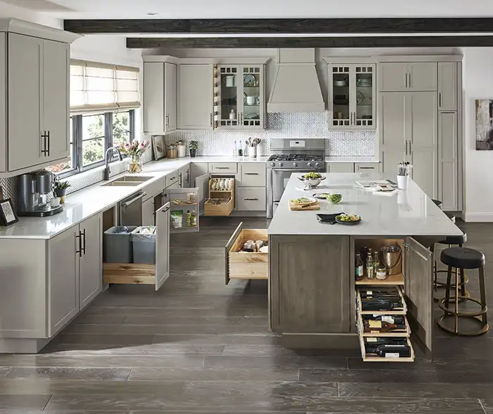 Kitchen with several cabinets pulled out showing how deep they are