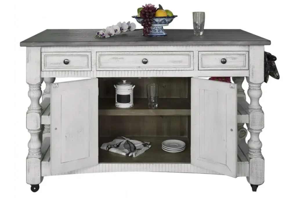 Wood kitchen island with the wood lightly distressed, showcasing a white finish and complemented by weathered gray tops.