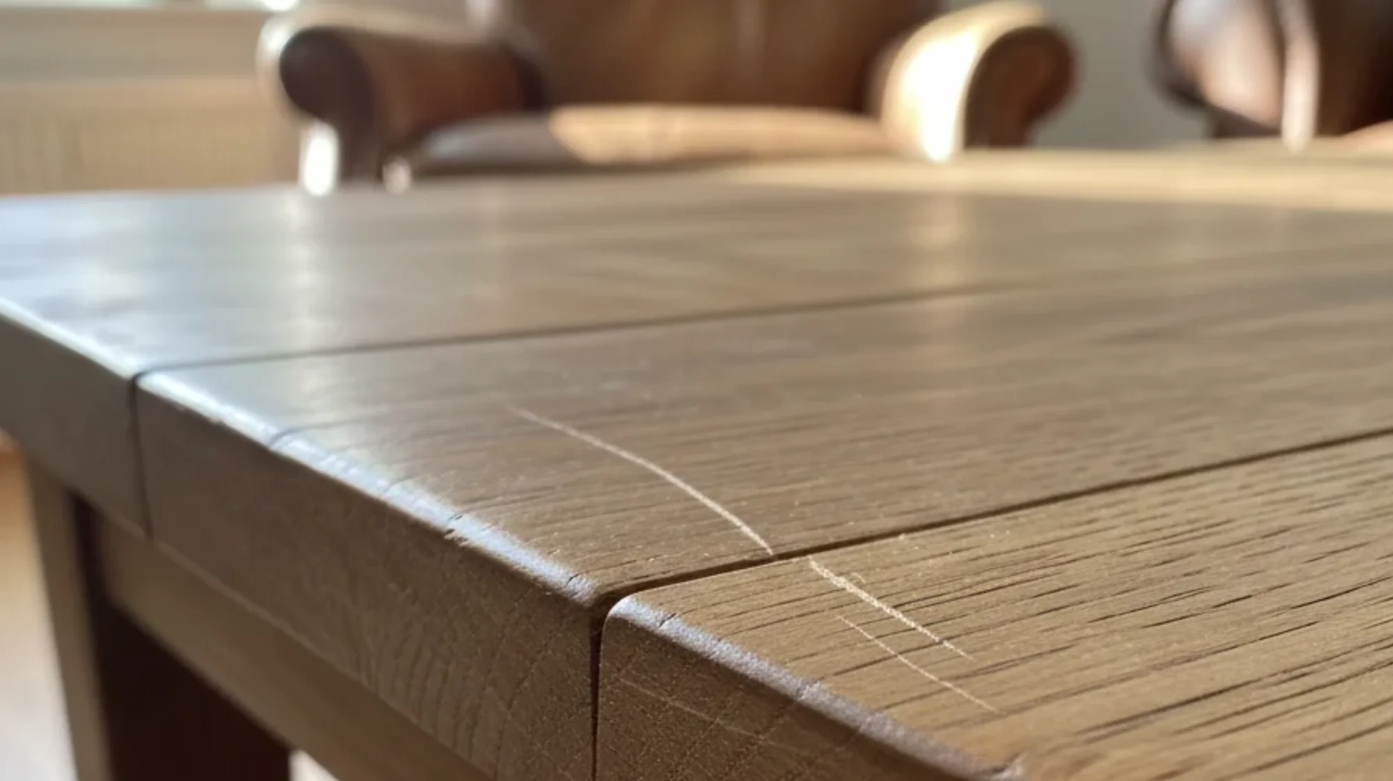 A real wood table with a surface scratch that needs to be repaired.